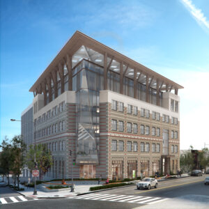 A large tan office building on a street corner