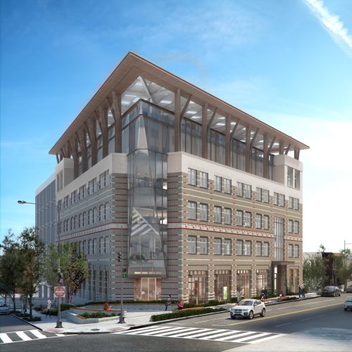 A large tan office building on a street corner