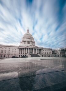 capitol building with a cloudy blue sky backdrop