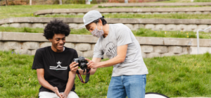 Two Youth in Focus students at a park doing a photo shoot