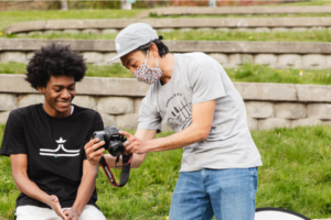Two Youth in Focus students at a park doing a photo shoot