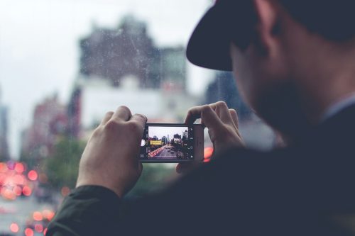 Man captures photo on his phone.